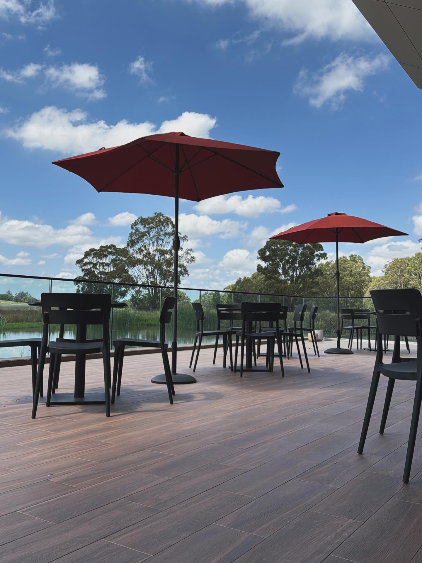 Lakeside terrace with red umbrellas
